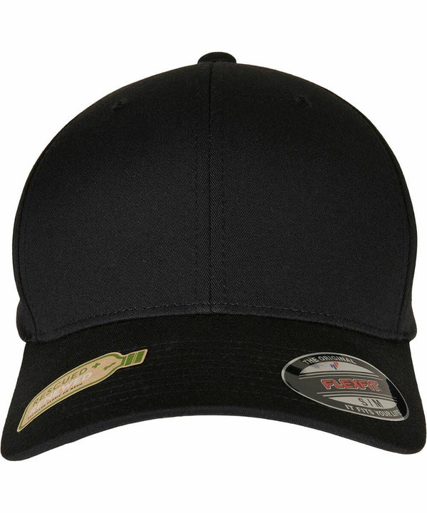 Black baseball cap with curved brim, featuring stickers on the front indicating Flexfit By Yupoong and a reserved sticker. Plain and unadorned. This is the YP174 model.