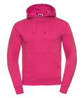 J265M hoodie by Russell in bright pink featuring a front pocket and drawstring hood, presented against a plain white background.