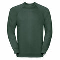 The Russell 7620M, a dark green sweatshirt featuring long sleeves and a round neckline, is displayed against a white background.