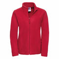 The Russell 8700F jacket features a vibrant red fleece material with a full zipper, standing collar, and two side pockets. The fabric looks soft and cozy. It is displayed against a plain white background.