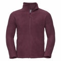 Introducing the Russell 8700M: a maroon fleece jacket featuring a front zipper and high collar. This jacket comes with zippered side pockets and boasts a soft, plush texture. It is presented against a plain white background.