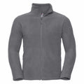 The Russell 8700M fleece jacket is showcased against a plain white background, featuring a high collar, front zipper, and zippered side pockets. The soft material appears warm and perfect for cool weather.
