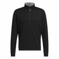 AD118 by adidas: A black long-sleeve quarter-zip pullover featuring a high collar, showcased against a plain background.