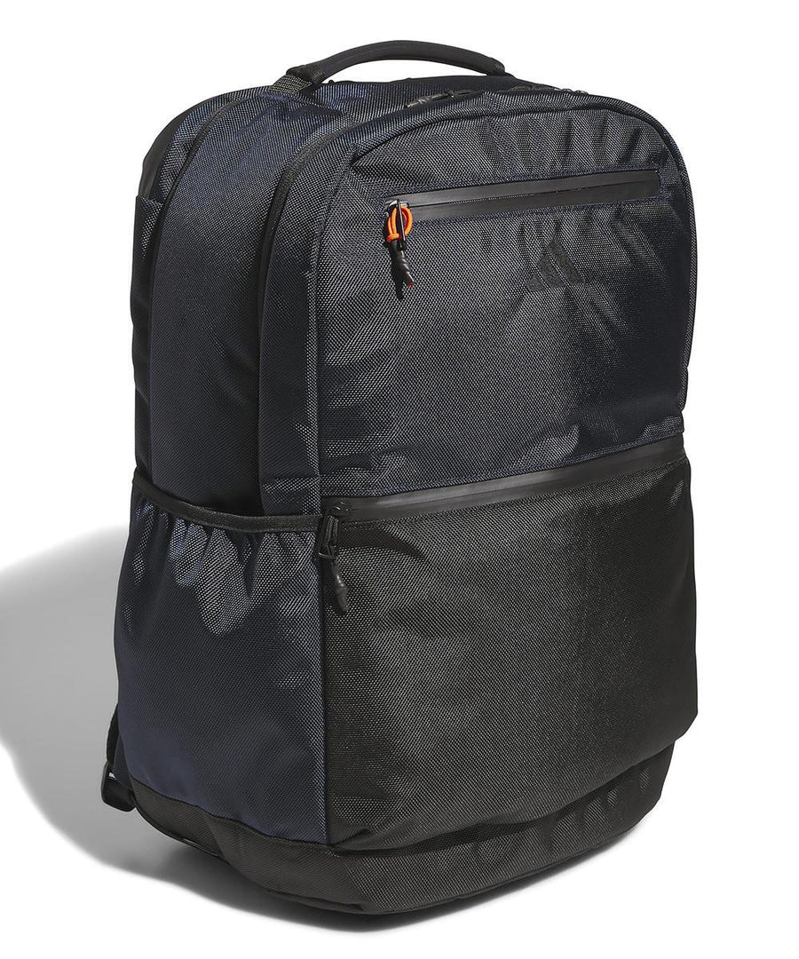 The adidas Rucksack is black and dark grey with a top handle, front and side zippered pockets, and a mesh side pocket, displayed against a white background.