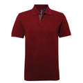A plain burgundy polo shirt, labeled as AQ012 from Asquith & Fox, with a collar and short sleeves is displayed against a white background. The shirt includes a button placket at the collar.