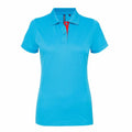 Product Name: AQ022 by Asquith & Fox - A vibrant blue short-sleeved polo shirt for women, designed with a classic collar and a button-up front. The inner placket showcases a contrasting bright red color. The shirt is displayed against a plain white background.