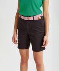 Person wearing an Asquith & Fox AQ068 green top, black shorts, and a pink belt.