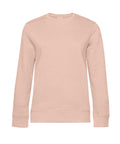 A plain, long-sleeved crew neck sweatshirt in light beige or blush pink, shown against a white background. It features a simple design with no visible logos, patterns, or decorations.