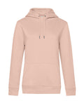 A plain light pink hoodie with long sleeves, front pocket, and drawstrings is shown on a white background. The hoodie has no visible logos or patterns.
