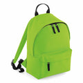 Introducing the Bagbase B125S: a vibrant green backpack featuring black zippers and adjustable straps. It includes a front zippered pocket along with a main compartment for added convenience.