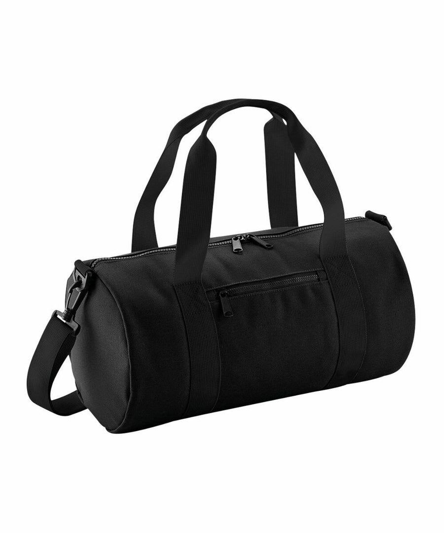 A black cylindrical duffel bag with dual handles and an adjustable shoulder strap. The **Bagbase B140S** has a front zippered pocket and a top zip closure. The material appears to be durable fabric.