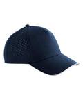 Caps: Navy blue baseball cap featuring small side ventilation holes, a curved brim with a subtle white edge, and a simple solid design.
