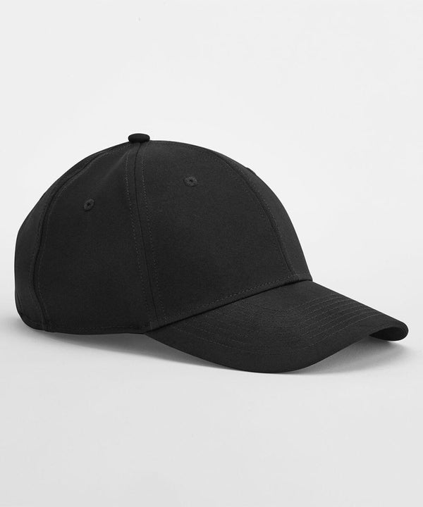 A black Beechfield B172R baseball cap with six panels and a curved brim, placed on a plain white background. The cap has a button on top and two visible eyelets on either side for ventilation. The stitching on the cap is visible, indicating its sections and structure.