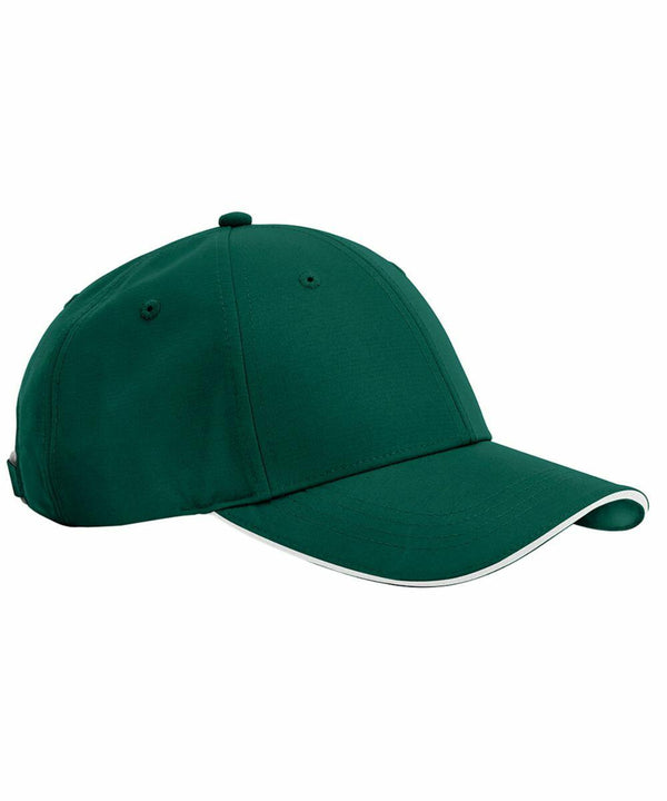 A dark green B195R from Beechfield with a curved brim. The B195R features a white lining along the edge of the brim and six ventilation eyelets on the crown. The B195R is shown from a side angle.