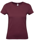 The B&C Collection B210F is a simple maroon T-shirt featuring short sleeves and a round neckline, showcased against a white background.