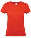 The B&C Collection B210F shirt, featuring a plain red design, short sleeves, and a round neckline, is displayed against a white background.