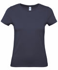 The B210F by B&C Collection is a plain navy blue t-shirt featuring short sleeves and a round neckline, displayed against a white background. The fabric looks smooth and lightweight.
