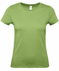 A product from B&C Collection, the B210F, is showcased on a white background. It features a plain green color with short sleeves, a round neckline, and boasts a simple, fitted design.