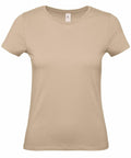 The B210F by B&C Collection is a plain beige short-sleeve T-shirt with a crew neck, showcased against a white background. This shirt features a fitted, casual design ideal for everyday wear.