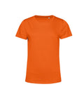 A plain orange T-shirt with short sleeves and a round neckline is shown on a white background, featuring a simple, unadorned design.
