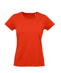 The image displays a women’s fitted T-shirt in solid red with short sleeves and a crew neckline, featuring no logos or designs. The product is shown against a white background.
