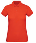 The B&C Collection's B260F is a vibrant red short-sleeve polo shirt, featuring a collar and buttons.