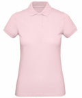 A light pink short-sleeve polo shirt from the B&C Collection, featuring a collar and three buttons, displayed against a white background.