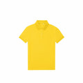 A plain yellow B&C Collection polo shirt, model B265F, featuring short sleeves and a collar, displayed against a white background.