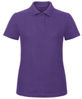 A solid purple B&C Collection B306F polo shirt featuring short sleeves and a button-up collar, displayed on a plain white background.
