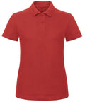 The B&C Collection B306F is a plain red polo shirt featuring a collar, short sleeves, and a three-button placket.