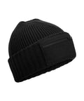 The Beanies features a black ribbed knit design, a folded brim, and a front zipped pocket.