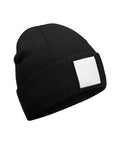 The Beanies product is a black knitted beanie featuring a folded brim and a plain white rectangular patch on the front, shown against a white background.