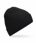A Beechfield B376R black knit beanie featuring a folded brim is displayed against a white background.