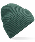 A Beechfield B384R green knit beanie hat with a folded cuff is displayed at an angle against a white background. The ribbed texture is evident, emphasizing its soft fabric.