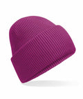 The B385R by Beechfield is a vibrant purple knitted beanie featuring a folded cuff, set against a white background. Its ribbed texture is clearly visible, giving the appearance of floating with a soft shadow beneath it.
