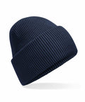A Beechfield B385R navy blue knit beanie with a folded cuff is displayed on a white background. The thick, textured fabric makes it ideal for cold weather. Positioned at an angle, the beanie highlights its design.