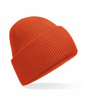 The Beechfield B385R is an orange knitted beanie hat with a folded brim, showcased against a white background.