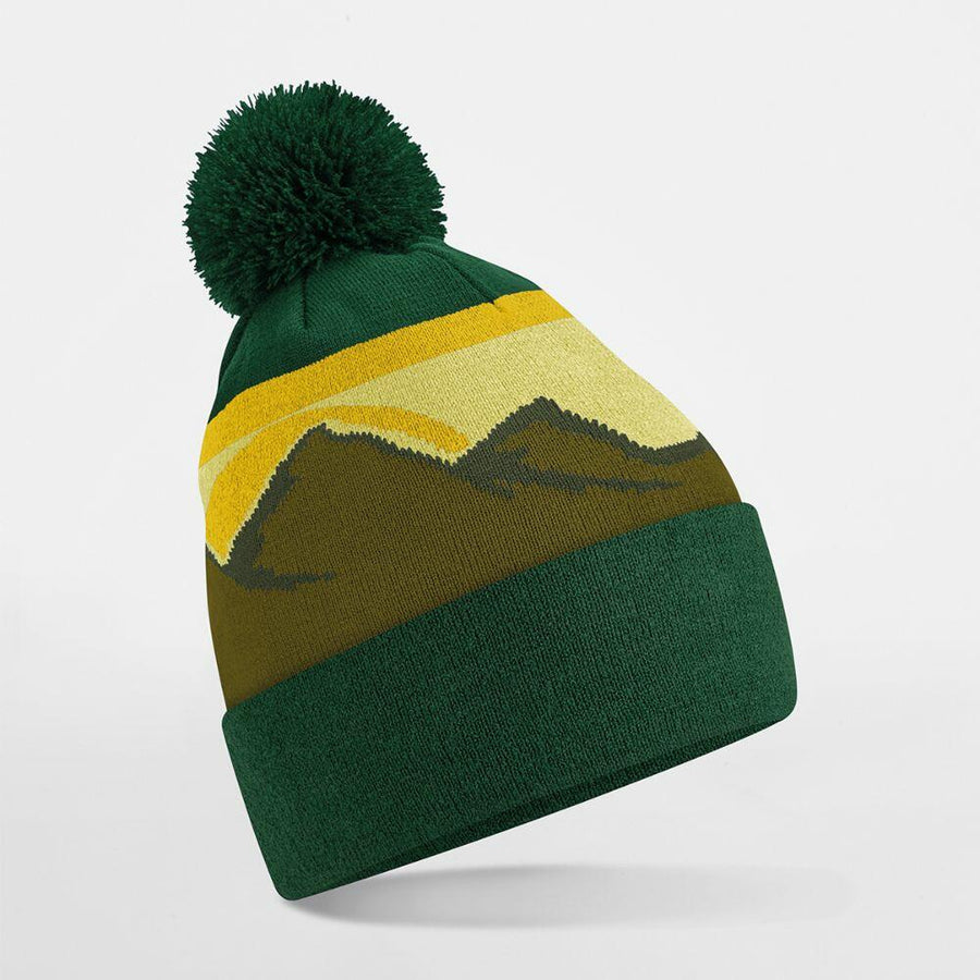 Beechfield's B395R is a green knit beanie with a yellow and dark green mountain design, complete with a pom-pom on top.