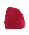The Beanies is a plain red knitted hat featuring a turned-up brim and a rectangular patch on the front, shown against a white background.