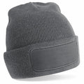 Beechfield B445R gray knitted beanie featuring a blank patch on the front.