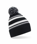 A Beechfield B473R beanie featuring black and white horizontal stripes with a pom-pom on top.