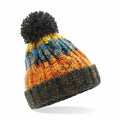 The Beechfield B486A is a knitted beanie with vibrant stripes in orange, blue, and yellow, accented by a dark pom-pom and brim.
