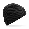 The Beechfield B508R is a ribbed knit beanie in black, featuring a folded cuff.