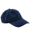 The Caps product is a navy blue baseball cap with a curved brim and stitched ventilation eyelets, displayed at an angle on a plain white background.