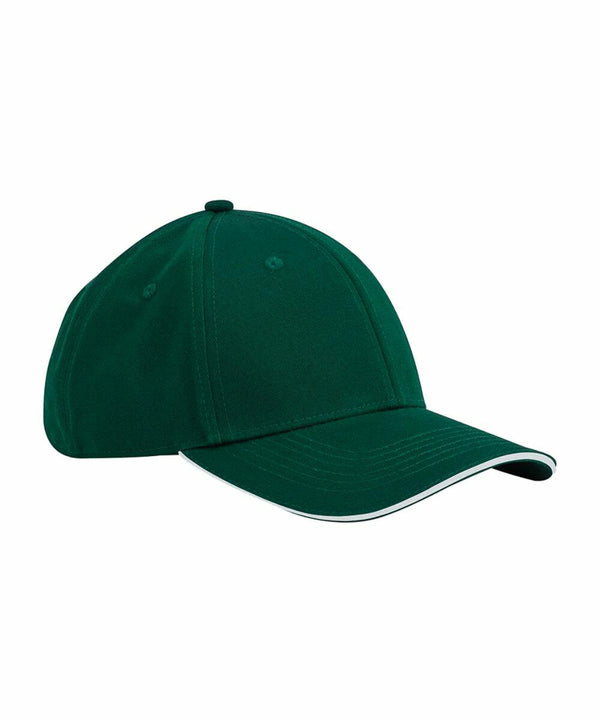 A dark green Beechfield B820C with a black button on top and white piping along the edge of the brim. The cap has a six-panel construction and a curved visor.