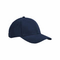 The Beechfield B821B baseball cap, featuring a plain navy blue design with a curved brim, is displayed against a white background. This cap includes six panels and an adjustable strap at the back.