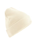 A cream-coloured knitted beanie hat with a turned-up brim is displayed against a white background.