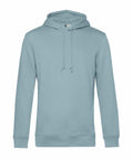 A light blue BA001 hoodie from B&C Collection, featuring a drawstring hood and long sleeves, displayed against a white background.