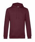The BA001 hoodie by B&C Collection is maroon with long sleeves and a front pocket. It includes an adjustable drawstring hood and ribbed cuffs and hem, making it ideal for everyday casual wear.
