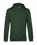 The B&C Collection's BA001 is a plain forest green hoodie with long sleeves and a front pocket. It boasts a drawstring hood and ribbed cuffs and hem, offering a simple design that emphasizes its solid color and casual style.